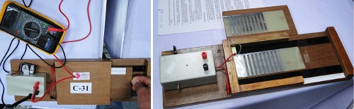 Sestava 1. experimentální úlohy a&nbsp;otevřená černá skříňka (ta nebyla studentům k dispozici)